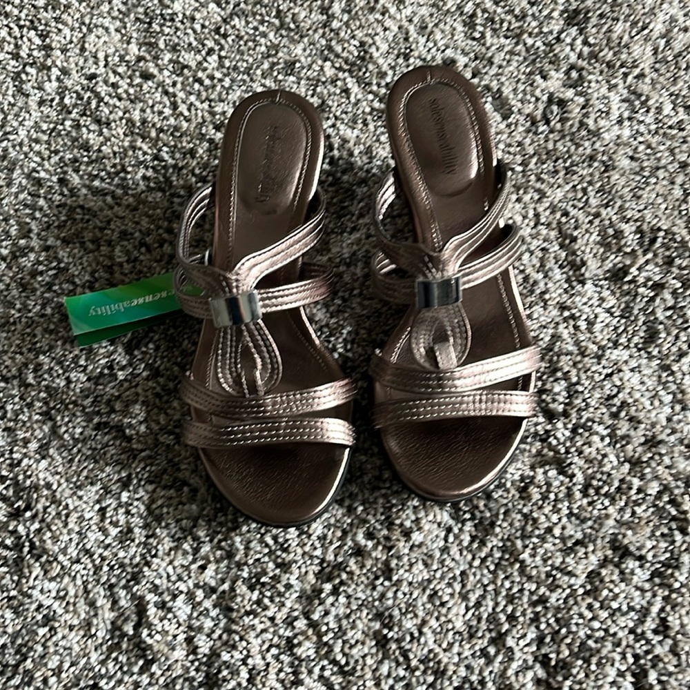 Metallic color slip on wedge sandals.